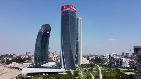 ITALY, MILAN JULY 2020, drone aerial view of (Il DrittoThe Straight One), Generali (Lo StortoThe Twisted One), PwC (Il CurvoThe Curved On) in CityLife district  shopping area after Covid19 lockdown