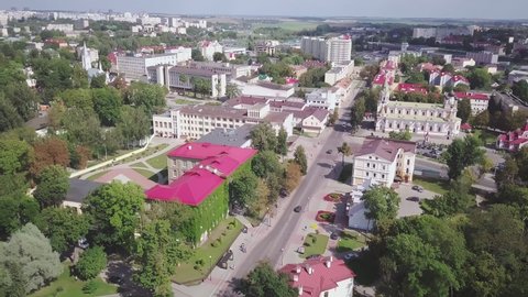 Drone flying left around University, Cathedral on old street in Grodno.