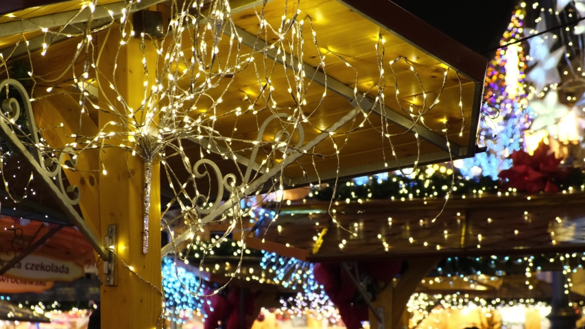 Christmas lights, led garland on a design of decorated new year fair in a city street at night. | Shutterstock HD Video #1055791832