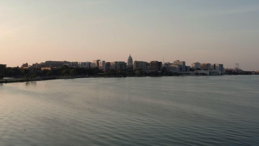 Flying low above Lake Monona with Madison skyline at background. Late afternoon light