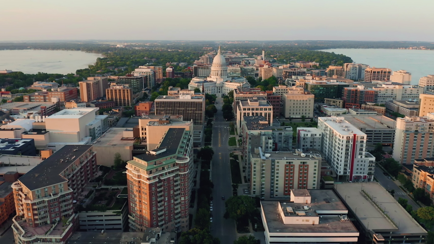 Aerial overhead view of street leading to Madison city center and capitol building. Warm sunset light