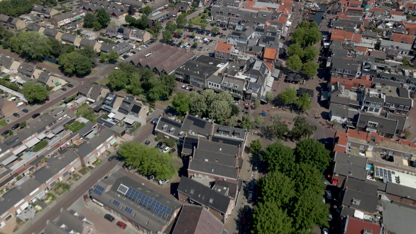 Aerial overview of beautiful, small town in the Netherlands with boats docked in canal