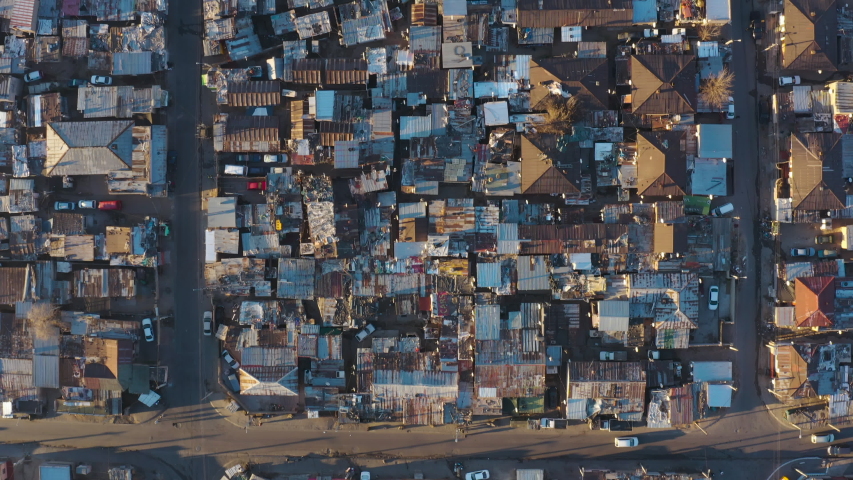 Aerial view of the densely populated Alexandra township. Social distancing to prevent Covid-19 is almost impossible due to poverty and overcrowding.  Gauteng Province, South Africa Royalty-Free Stock Footage #1055835854
