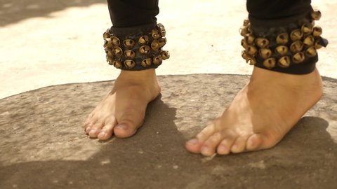 Bharatanatyam Indian classical dance move, closeup of feet rotation shot