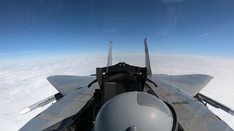 CIRCA 2020 -Dramatic aerial of F-15 fighter aircraft during a mid-air refueling exercise at an MSPO Exposition in Poland.
