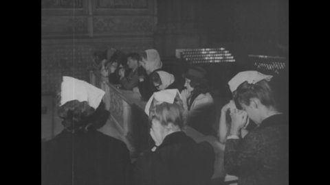 CIRCA 1963 - Christians are seen praying in church after JFK's assassination, the General Assembly of the UN holds a minute of silence.