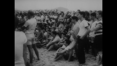 CIRCA 1964 - Australians Midget Farelly and Nat Young are seen at the World Surfboard Championships begin on Makaha Beach in Hawaii.