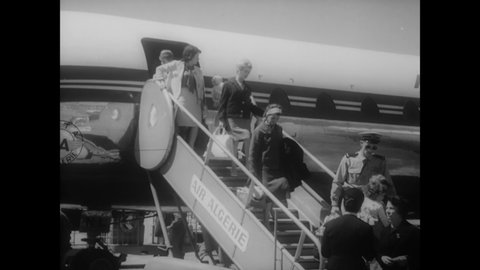 CIRCA 1962 - Families of European refugees evacuate Algeria by plane and ship during the Algerian war.