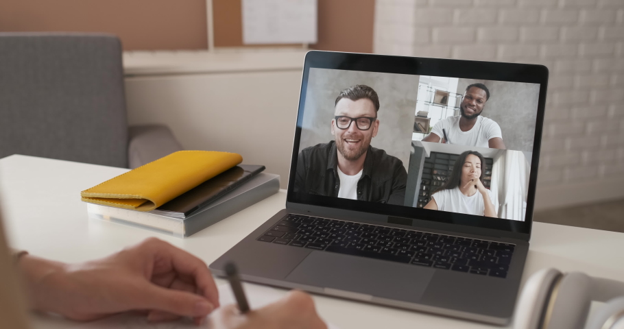 Discussing project online. Multi-ethnic group video call. Remote communication of happy multiracial young people. Working from home office during pandemic. Webcam view. Business chat conference | Shutterstock HD Video #1055858015