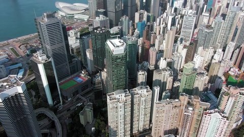 Hong Kong upscale Wan Chai district and Victoria Harbour skyscrapers, Aerial view.