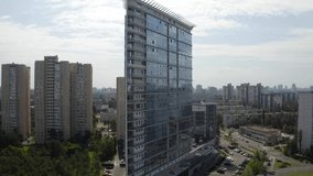 Aerial view to the glass modern multi-storey residential building in the city center. Kiev panoramic view. Ukraine. 
