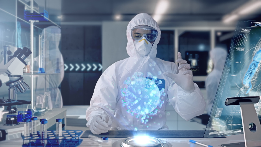 Male Scientist analyzing and interacting with a 3D Rotating Coronavirus Virus Cell Hologram in a Secure High Level Modern Laboratory. Genetic Engineering Research Facility. Pandemic Research. - Powered by Shutterstock - Get 15% off with code: PIKWIZARD15
