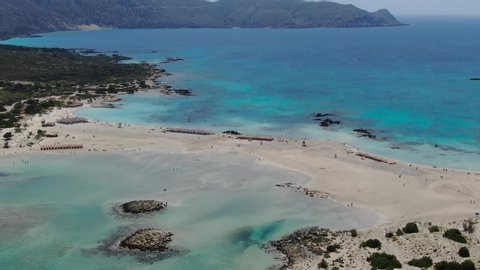 Ocean lagoon at Elafonissi Beach in Crete Greece panorama, Aerial dolly zoom out shot