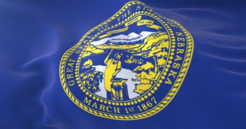 Flag of american state of Nebraska, United States, waving at wind. Loop