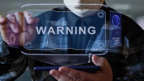Unrecognizable elderly man in a protective mask interacts with HUD holograms on a smartphone with text Warning. Old man in a plaid shirt with a holographic screen on a blurred background - Powered by Shutterstock - Get 15% off with code: PIKWIZARD15