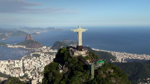 Rio de Janeiro, Brazil, aerial view of iconic Christ the Redeemer statue and Sugarloaf Mountain during summer.