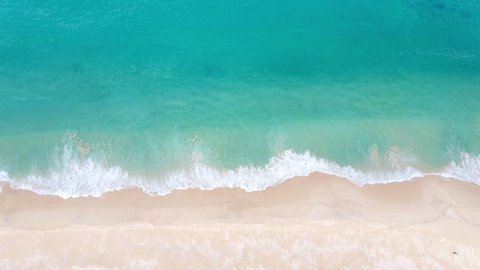 4K Aerial view top view drone move Beautiful topical beach with white sand. Top view empty and clean beach. Beautiful Phuket beach is famous tourist destination at Andaman sea.
