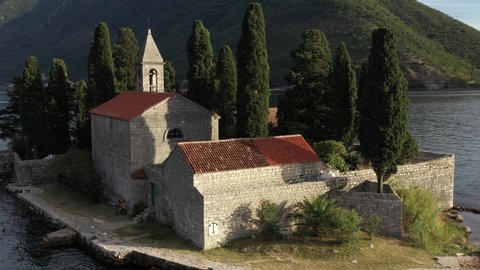 St. George and Gospa od Skrpela islands near town Perast in Montenegro. Sunset. Drone footage.
