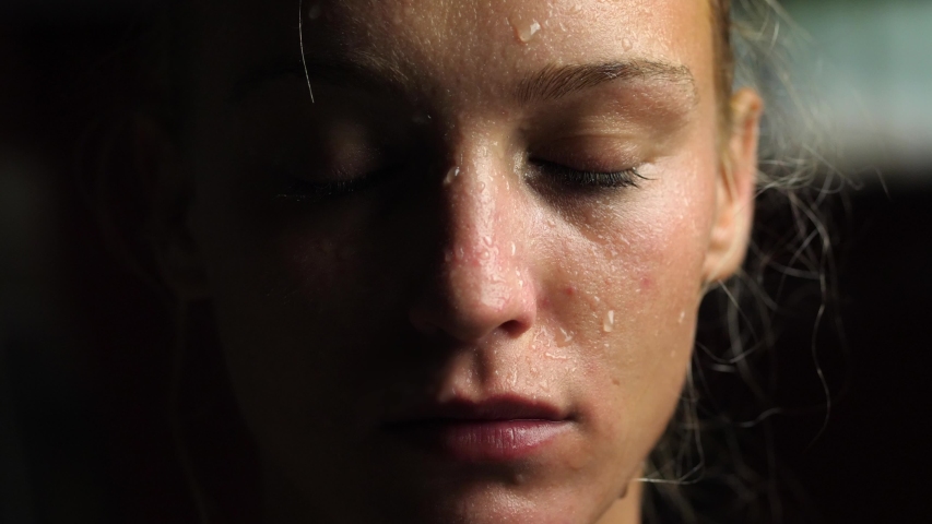 Sweaty Woman Opening Eyes and Looking at the Camera, Close-up Royalty-Free Stock Footage #1055920211