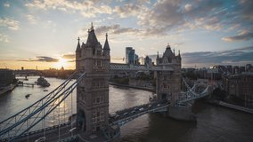Iconic Tower Bridge, Sunset, Aerial View Shot of London UK, United Kingdom, sun beautifully slides across bridge