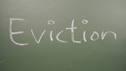 Concept of stop eviction or foreclosure, cancelling eviction written on board