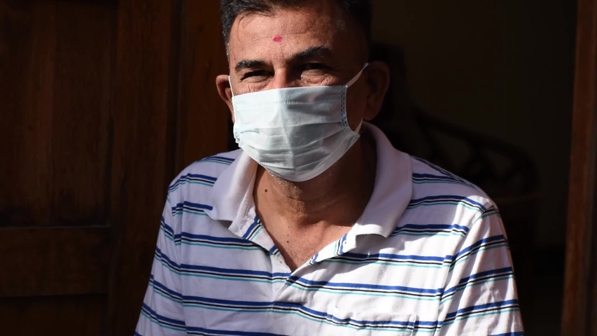Indian man wearing medical mask doing namaste during the coronavirus pandemic Royalty-Free Stock Footage #1055928587