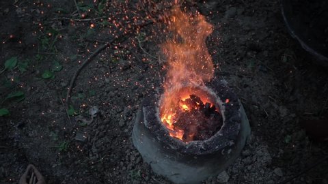 reconstruction of an ancient Celtic bellows forge for the fusion of bronze on the ground