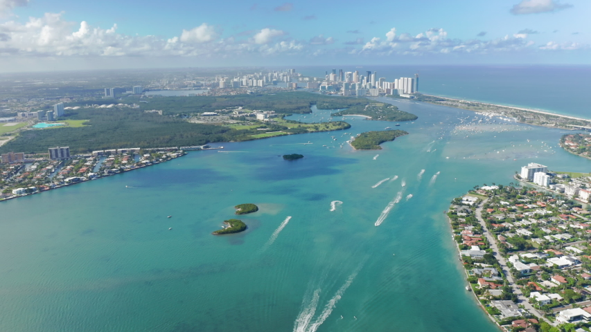 South Beach nature, Florida, USA. 4K aerial panorama of clean light-green sea waters in Miami bay. Residential front line buildings with beautiful Atlantic ocean view. Background for travel business Royalty-Free Stock Footage #1055963681