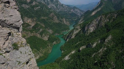 Aerial shot of the Shala river in north of Albania. Wild rocks and beautiful green trees all over the mountains.