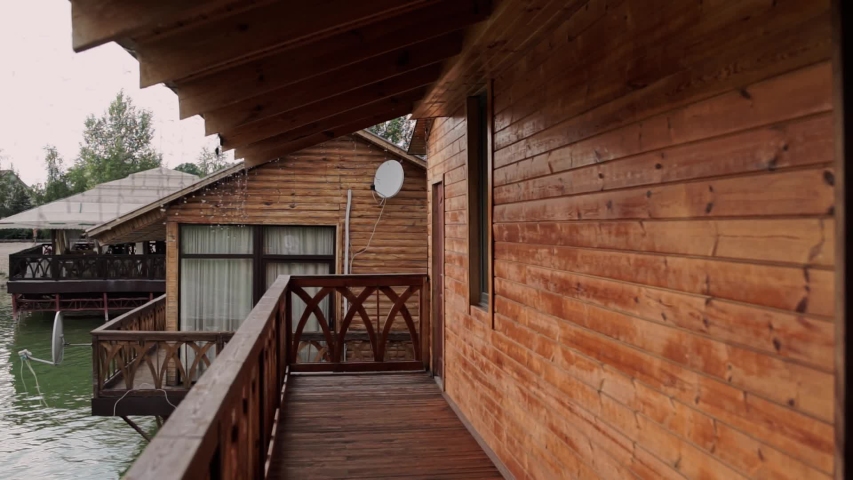 wooden porch of a house on the water