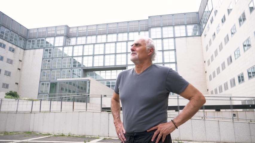 Slow motion shot of senior athletic man looking away