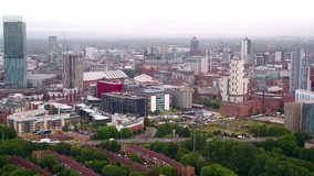 Slow drifting aerial drone shot of the city of Manchester skyline and Beetham tower from the air on a grey cloudy day
