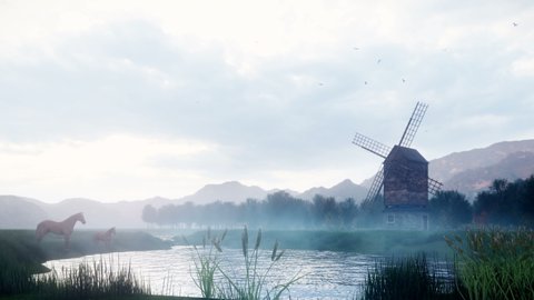 A rural misty morning landscape with an old windmill and horses next to a pond, grasses and plants swaying in the wind background a cloudy sky.