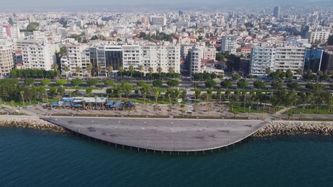 Molos Cyprus promenade in Limassol.  Drone fly over one of the most famous promenades in Cyprus in the early morning. City view.