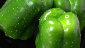 Fresh green wet bell peppers close up rotation - Powered by Shutterstock - Get 15% off with code: PIKWIZARD15