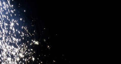 4K Sparks hits on Black Background, Sparks Over Black (ULTRA HD, UHD, 4K). Spark Wall created by Gun Powder Sparks Falling. Slow Motion. (ADD MODE)