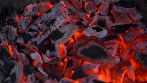 Burning red organic charcoal texture in bbq grill