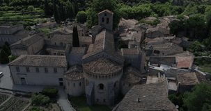 Saint-Guilhem-le-Désert aerial lateral travelling, Hérault, labelled Les Plus Beaux Villages de France