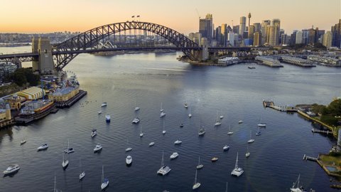 Hyperlapse drone lapse of Sydney city skyline during sunrise. Tilt up