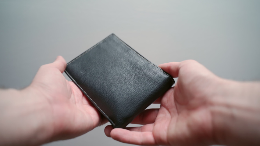 Unemployment during financial crisis, male opening black leather wallet, empty wallet and no paper currency. Wallet with coins inside, bankruptcy and poverty concept Royalty-Free Stock Footage #1056015398