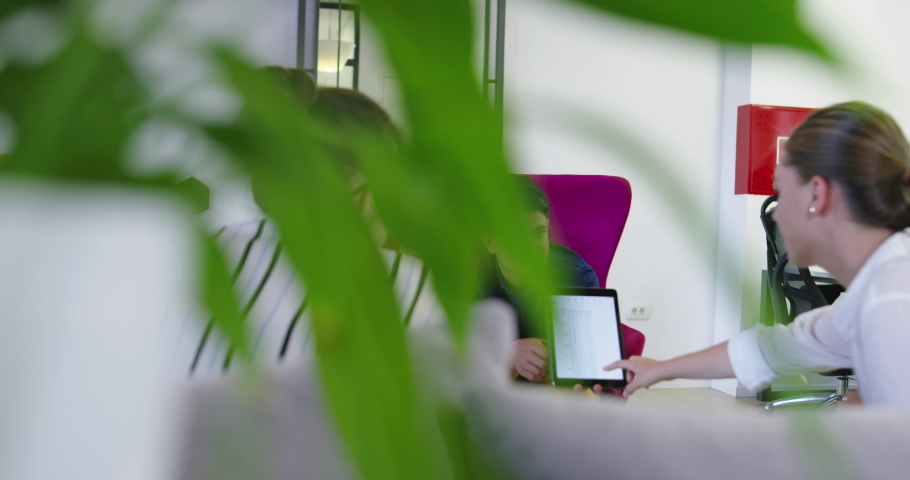 Business people connected on internet network with a tablet in a relax room. concept of startup company