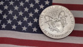Silver dollar and american flag Cash money banknotes and coins. Finance and investment concept. Closeup shot. Currency exchange of one hundred usd. Rich business economy of usa - Powered by Shutterstock - Get 15% off with code: PIKWIZARD15