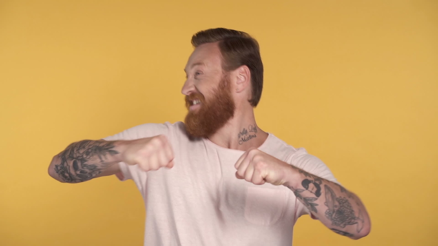 Bearded man showing sucess emotion and gesture. Slowmotion.