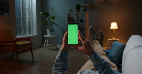 Close up shot of man holding a smartphone with chroma key mock up green screen - technology, connections, communications concept 4k video template