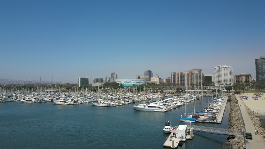 Aerial Drone Footage of Docks Approaching downtown Long Beach California - Sailboats