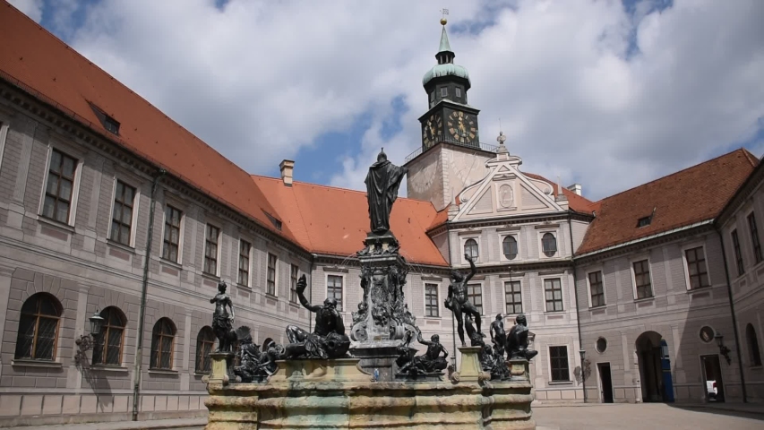 Octagonal yard called Fountain Courtyard (Brunnenhof) is one of the ten courtyards of the Residenz Palace. The bronze Wittelsbach Fountain in the middle was erected in 1610 Royalty-Free Stock Footage #1056051299