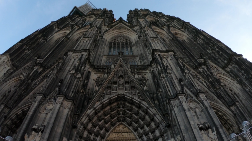 SLOW MOTION SHOT - Entrance gate to the Cologne Cathedral (Kolner Dom), Roman Catholic cathedral church, located in the city of Koln, Germany. It is the largest Gothic church in northern Europe.