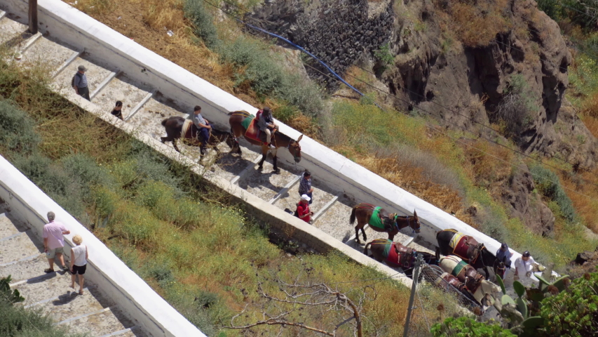 Santorini donkey road. Aerial view of te old road to the port in Santorini used as tourist attraction to travel riding a donkey