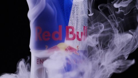Aluminium can of Red Bull Energy drink Sugarfree in smoke. Red Bull is the most popular energy drink in the world. Slow motion 180 fps. MINSK, BELARUS, July 17, 2020