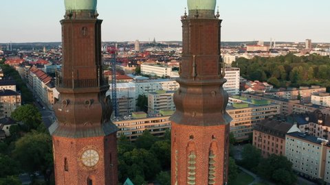 Church towers in Stockholm, Sweden. Beautiful summer evening with view over the city hall, down town and the sea of Mälaren.